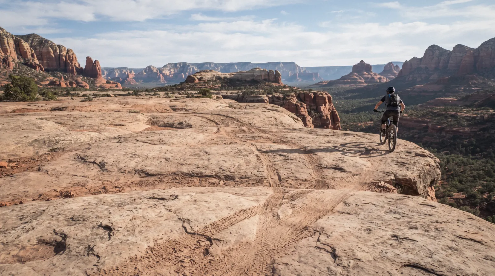 Slickrock trail surface with jeep tire tracks toward Chicken Point on Broken Arrow Trail Sedona