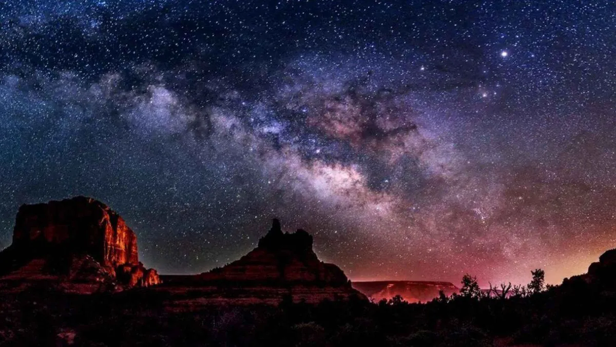 Traveler using night-vision goggles to scan the Sedona night sky